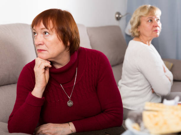 istock mature females quarreling on sofa 1175163574