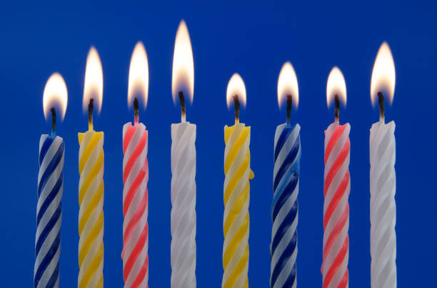 istock Colorful birthday candles on blue background 1175163577