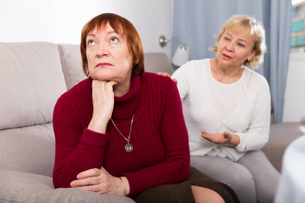 istock mature females quarreling on sofa 1175163584