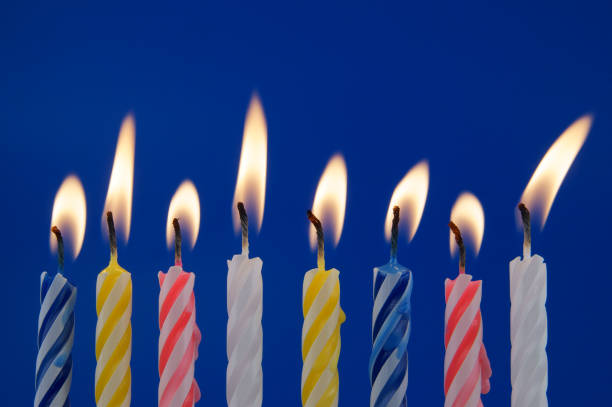 istock Colorful birthday candles on blue background 1175163598