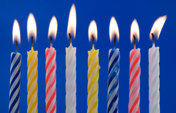 istock Colorful birthday candles on blue background 1175163612