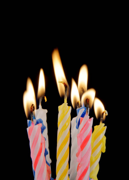 istock Colorful birthday candles on black background 1175163635