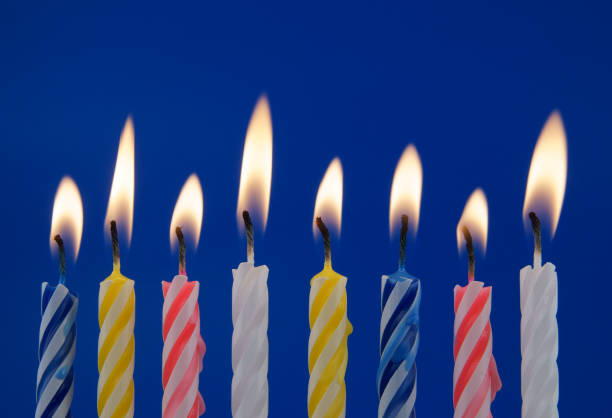istock Colorful birthday candles on blue background 1175163636