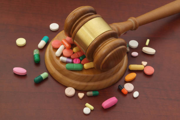 istock Judge gavel with drugs on brown table 1175164571