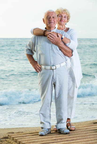 istock old female and male on the beach 1175164674
