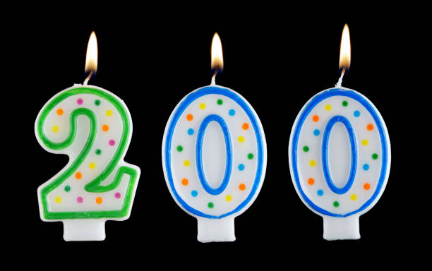 istock Birthday candles on black background, number 200 1175165040