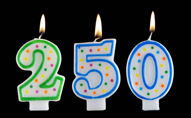 istock Birthday candles on black background, number 250 1175165070