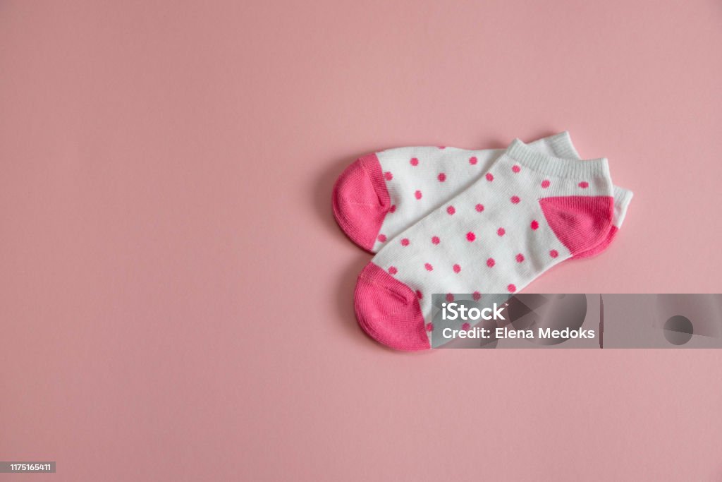 A Pair Of White Socks For Children With Pink Socks And Heels With Pink Dots  On A Pink Background Socks For Girls Stock Photo - Download Image Now -  iStock