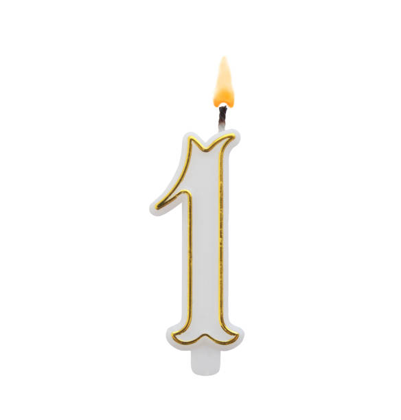 istock Golden birthday candle isolated, number 1 1175166235