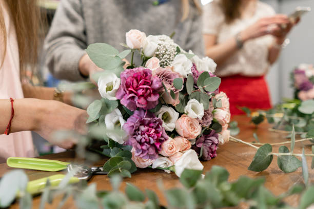 education in the school of floristry. Master class on making bouquets. Summer bouquet. Learning flower arranging, making beautiful bouquets with your own hands. Flowers delivery