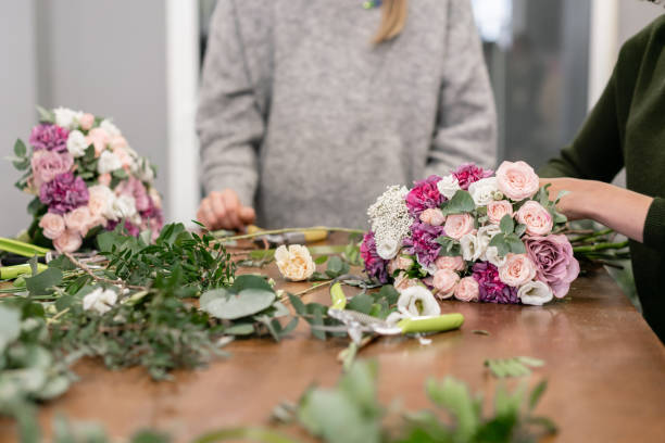 istock education in the school of floristry. Master class on making bouquets. Summer bouquet. Learning flower arranging, making beautiful bouquets with your own hands. Flowers delivery 1175167520