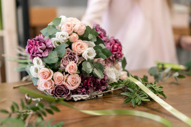 istock Master class on making bouquets. Summer bouquet. Learning flower arranging, making beautiful bouquets with your own hands. Flowers delivery 1175167602