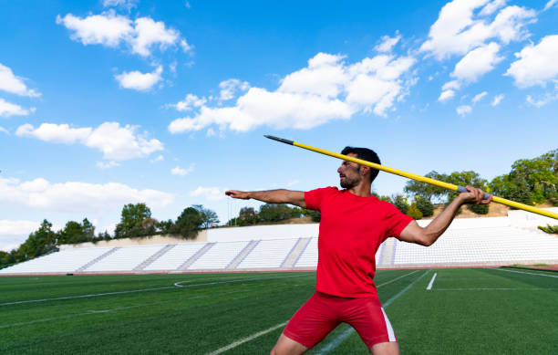 istock man athlete about to throw a javelin in the stadium. 1175172833