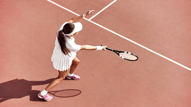 istock Tennis is her passion. Brunette is completely involved in the game 1175172986