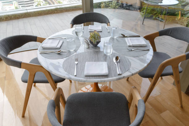 istock Table setting in the restaurant. Decorated elegant table, glasses, napkin, knife, fork and spoon 1175175143