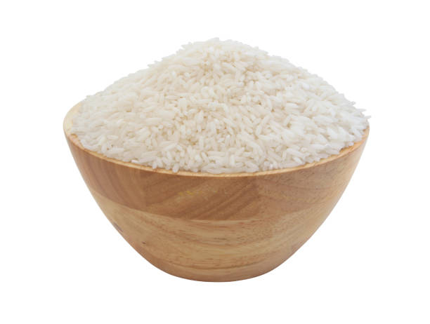 istock Rice in wooden bowl isolated 1175176098