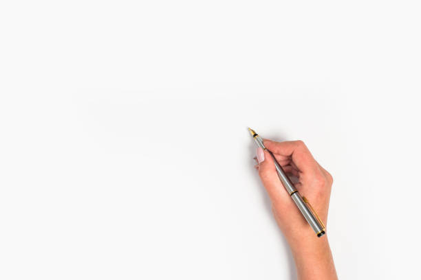 Female hands hold a pen. Isolated on white background. copy space, template.