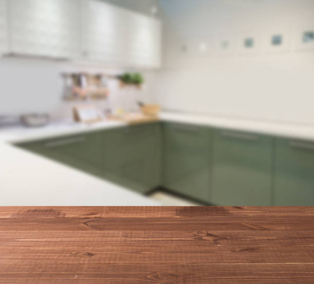 wooden table top and blur kitchen room of the background - domestic kitchen kitchen sink contemporary counter top imagens e fotografias de stock