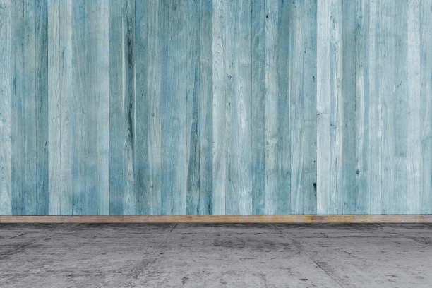 istock Empty room - concrete floor with wooden wall 1175176370