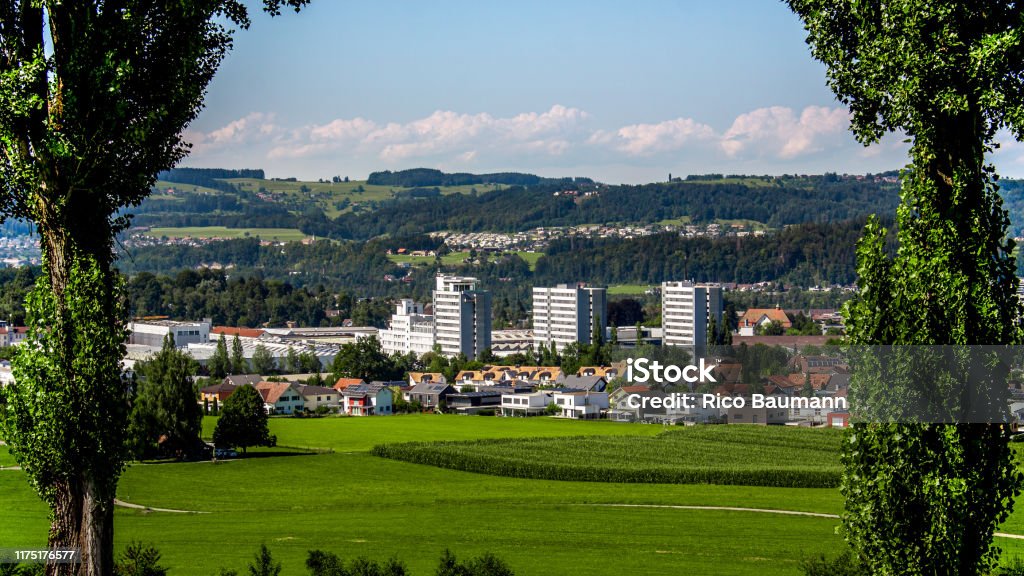 View of Uzwil in sunny weather A small industrial city in the east of Switzerland. Agricultural Field Stock Photo