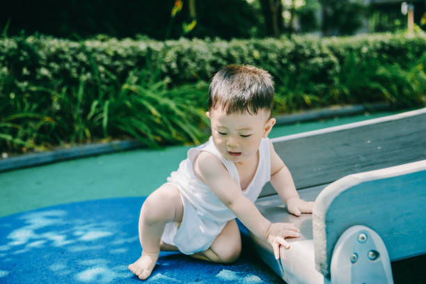 istock Asian baby is playing outside. 1175177282
