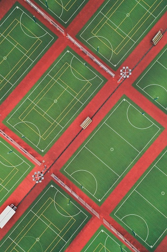 Aerial top-down of vibrant coloured netball courts