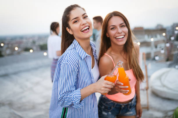 istock Happy young girls having fun at party 1175181605