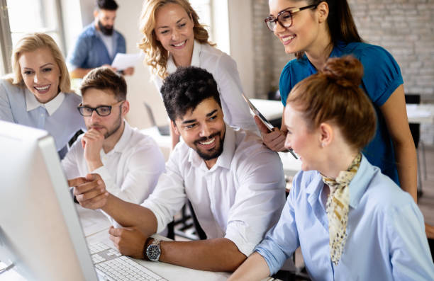istock Successful happy group of people learning software engineering and business during presentation 1175181759