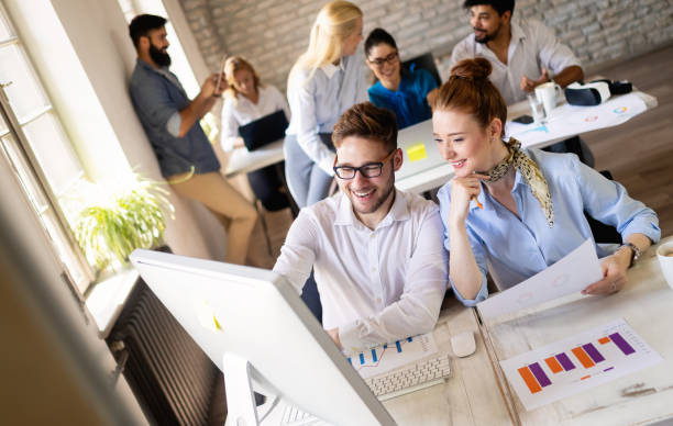 istock Startup business team on meeting in modern bright office interior brainstorming, working on computer 1175182417