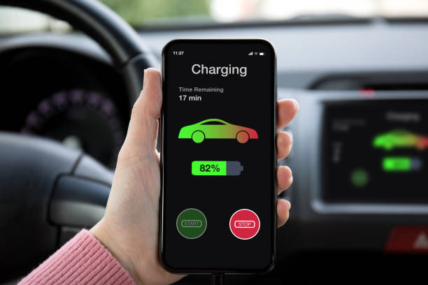istock phone in eco electric car touch multimedia system charging battery 1175184417
