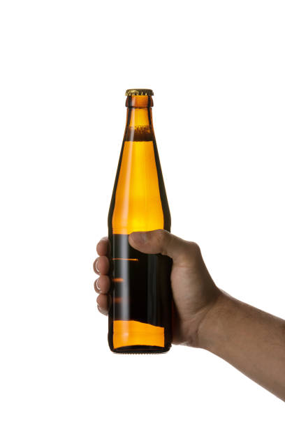 istock male hand holding brown beer bottle 1175184687