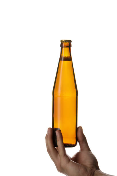 istock male hand holding brown beer bottle 1175184715