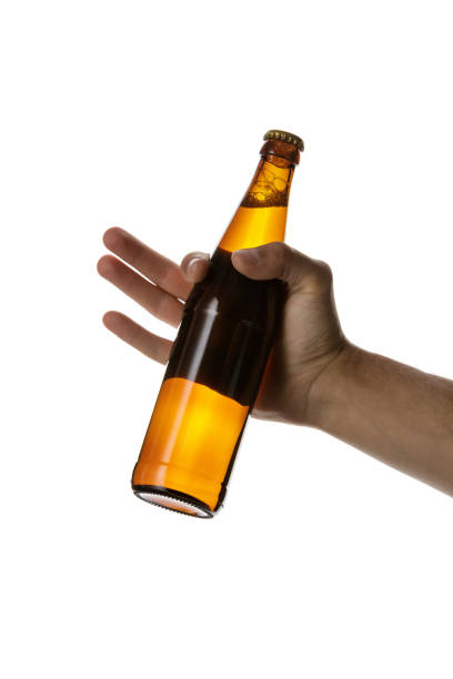 istock male hand holding brown beer bottle 1175184719