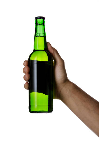 istock male hand holding brown beer bottle 1175184747