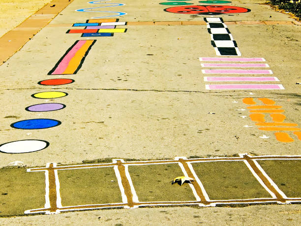 Hopscotch board drawn on asphalt.