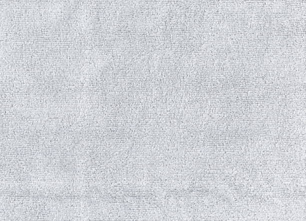 Closeup Grey color cleaning rag microfiber cloth background.Detail sample clean fabric texture backdrop. Closeup Grey color cleaning rag microfiber cloth background.Detail sample clean fabric texture backdrop. microfiber stock pictures, royalty-free photos & images