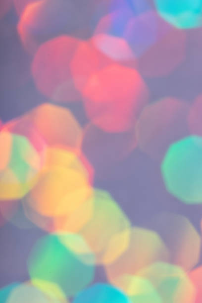 Colorful prism confetti blurred festive backdrop, trendy sparkles and glitter background, flat lay style. Christmas and holidays concept