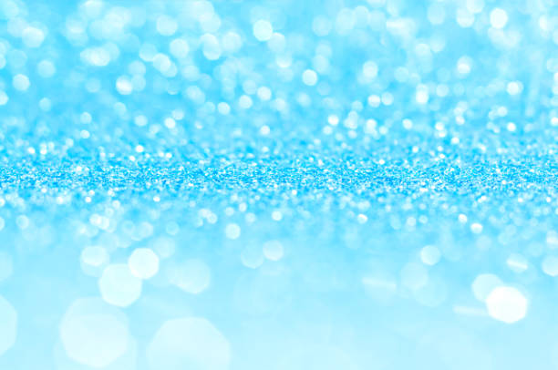 Blue,Silver white abstract light background, Blue shining lights, sparkling glittering Christmas lights. Blurred abstract elegance,smooth backdrop,artwork design for fathers day event background.