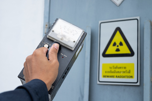 Supervisor use the survey meter to checks the level of radiation in the radioactive zone