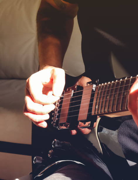 istock Musical lifestyle background. Playing the guitar. Guitarist's hand dynamic motion. Macro closeup. 1175192054