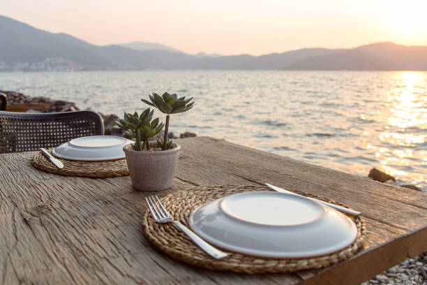 istock Travel table for lunch or dinner by the sea 1175195159