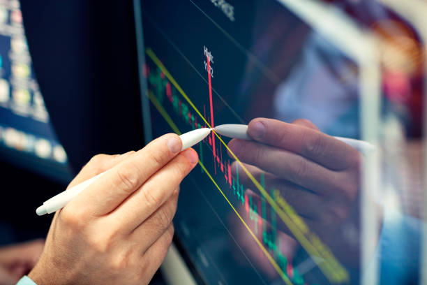 istock Online financial analysis on a computer monitor. 1175195711