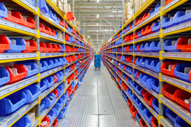 Diminishing perspective of warehouse Diminishing perspective of warehouse racks filled with red and blue trays filing tray stock pictures, royalty-free photos & images