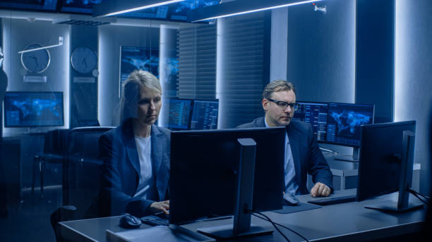 istock Diverse Team of Corporate Technical Specialists Work on Computers on Logistics of Import / Export. Professionals Collecting Data and Monitoring World Traffic. 1175197163