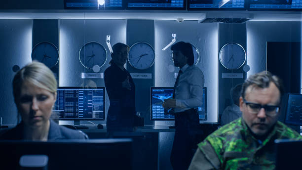 istock Government Cybersecurity Agency Professionals Working on Personal Computers in Cooperation with Army. Specialists Working on Computers in System Control Room. 1175197222