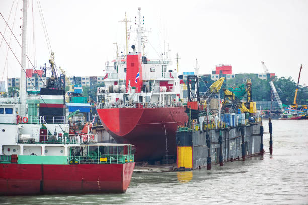 istock Cargo ship moored at the pier for maintenance. 1175201403