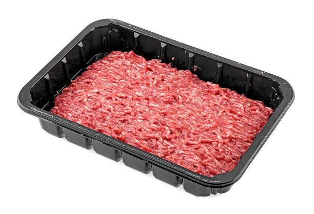 istock Black plastic tray with fresh raw minced meat on a white background 1175201645
