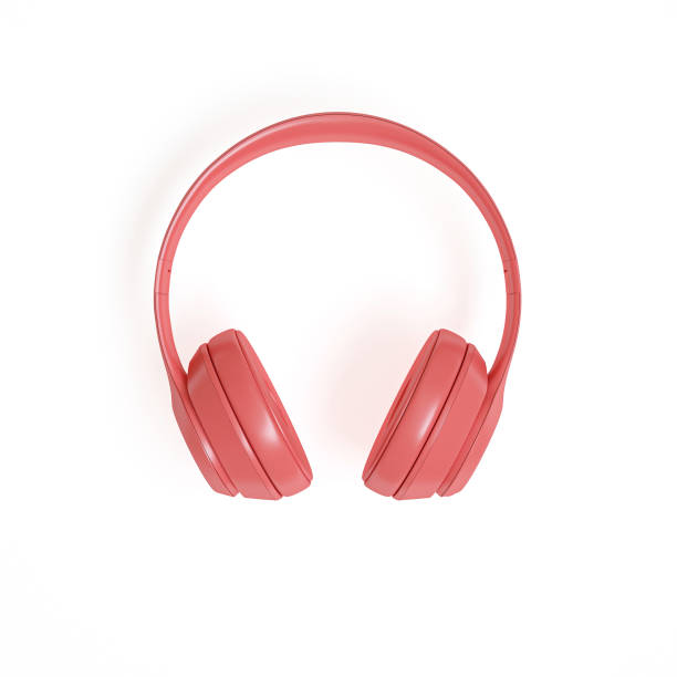 istock 3d render image of modern coral-colored audio headphones on a white 1175203318