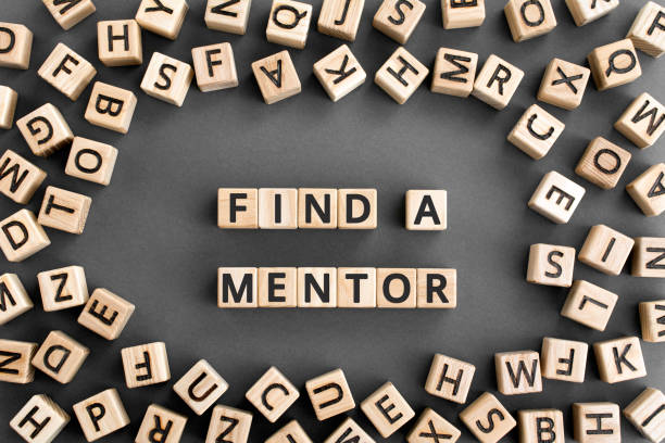 istock Find a mentor - phrase from wooden blocks with letters 1175203509