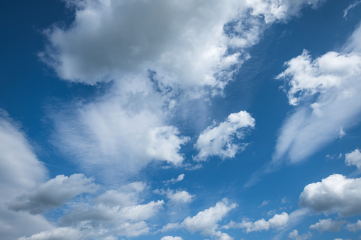 Beautiful background. White clouds in the blue sky.